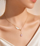 Collier ailes d'ange et perles d'eau douce blanches