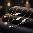 Collier ailes d'ange et perles d'eau douce blanches